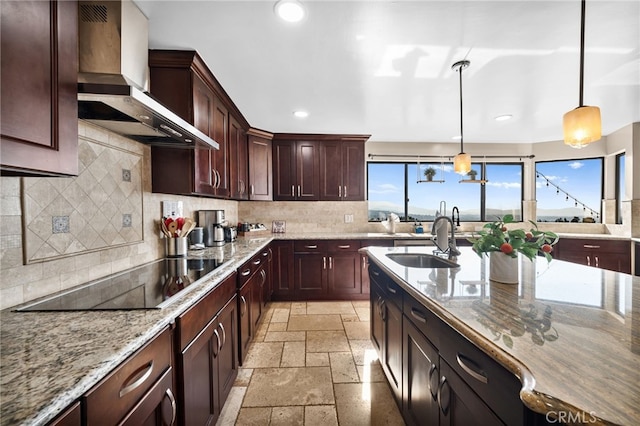 38225 Camino Sierra Rd, Temecula, CA 92592 - kitchen featuring wall chimney exhaust hood, black electric cooktop, stone tile floors, recessed lighting, and tasteful backsplash