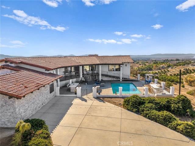 38225 Camino Sierra Rd, Temecula, CA 92592 - view of swimming pool with a patio area, a gate, and a mountain view