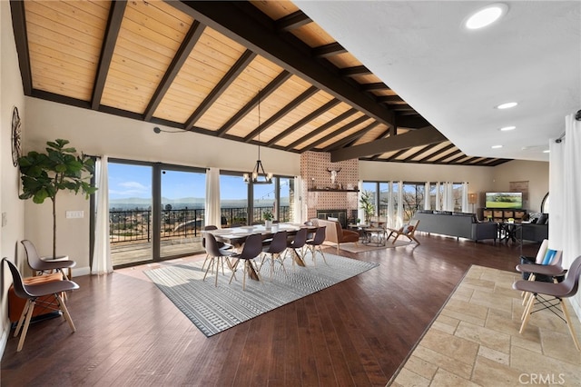 38225 Camino Sierra Rd, Temecula, CA 92592 - dining area featuring a fireplace, healthy amount of natural light, wood finished floors, recessed lighting, and a wooden ceiling with exposed beams