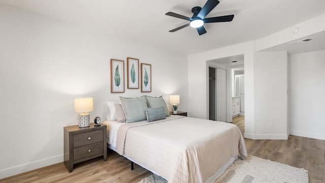 415 Stoney Point Way Unit 106, Oceanside, CA 92058 - bedroom with light wood-type flooring and a ceiling fan