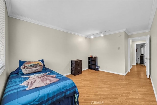 4170 Elm Ave Unit 304, Long Beach, CA 90807 - bedroom with light wood-style flooring, rail lighting, and crown molding