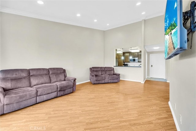 4170 Elm Ave Unit 304, Long Beach, CA 90807 - living room featuring crown molding, recessed lighting, and light wood-style flooring