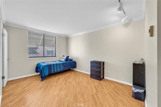 4170 Elm Ave Unit 304, Long Beach, CA 90807 - bedroom with light wood-style flooring, track lighting, and ornamental molding