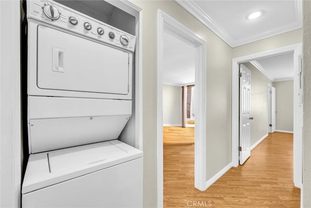 4170 Elm Ave Unit 304, Long Beach, CA 90807 - washroom featuring estacked washer and dryer, ornamental molding, and light wood finished floors