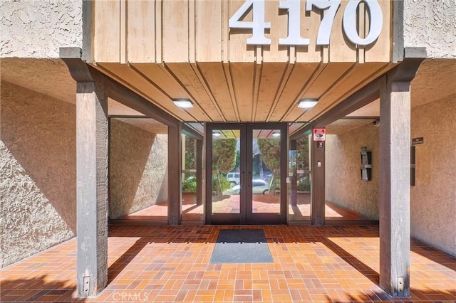 4170 Elm Ave Unit 304, Long Beach, CA 90807 - doorway to property with french doors and stucco siding