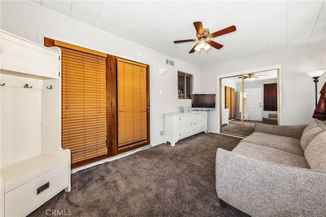 66890 Hacienda Ave, Desert Hot Springs, CA 92240 - living room with a ceiling fan and dark colored carpet