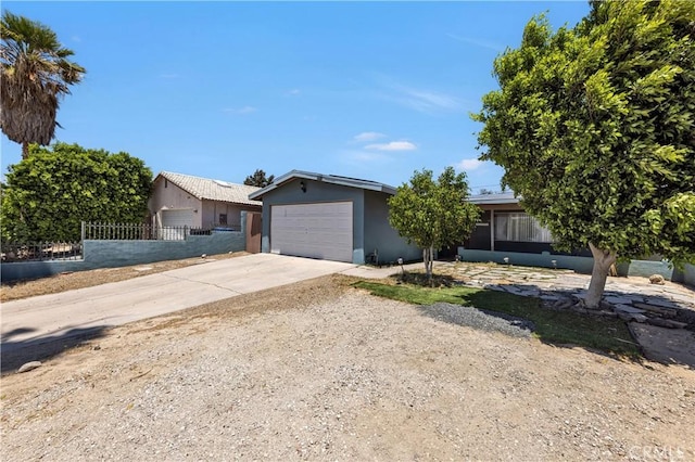 66890 Hacienda Ave, Desert Hot Springs, CA 92240 - ranch-style house with stucco siding, driveway, and a garage