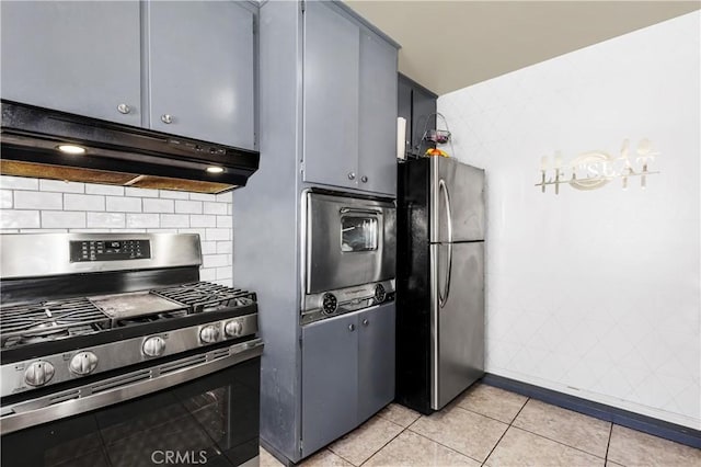 66890 Hacienda Ave, Desert Hot Springs, CA 92240 - kitchen with appliances with stainless steel finishes, under cabinet range hood, decorative backsplash, and light tile patterned flooring