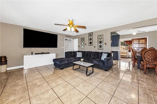 66890 Hacienda Ave, Desert Hot Springs, CA 92240 - living room with ceiling fan, a textured ceiling, and light tile patterned floors