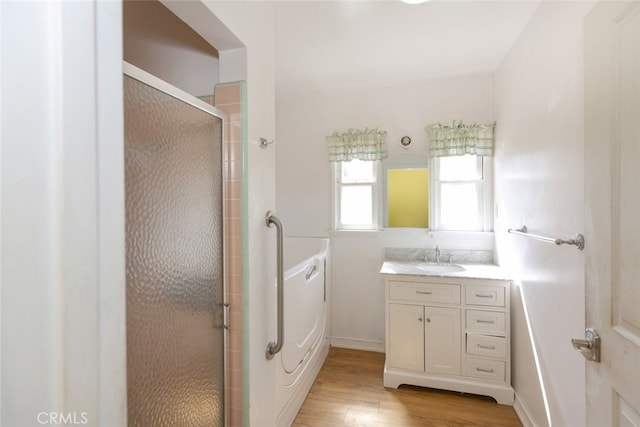 2046 E Glenoaks Blvd, Glendale, CA 91206 - bathroom featuring vanity, a shower stall, and wood finished floors