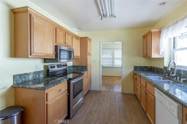 2046 E Glenoaks Blvd, Glendale, CA 91206 - kitchen featuring stainless steel appliances, dark wood-style floors, and dark stone counters