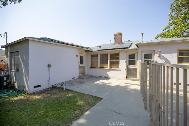2046 E Glenoaks Blvd, Glendale, CA 91206 - back of property with crawl space, roof mounted solar panels, a patio area, a chimney, and stucco siding