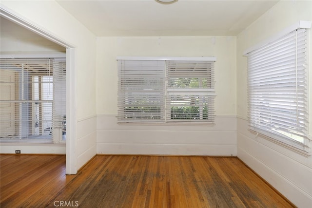 2046 E Glenoaks Blvd, Glendale, CA 91206 - spare room with wood finished floors, plenty of natural light, and wainscoting