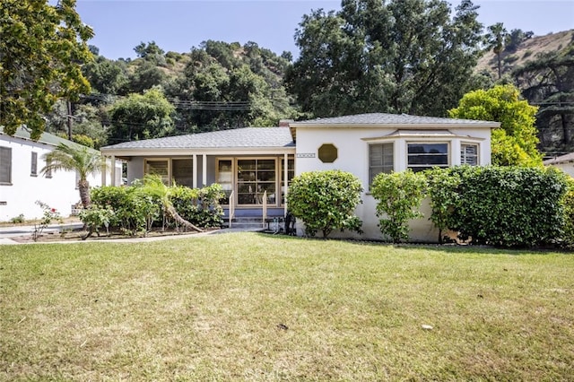 2046 E Glenoaks Blvd, Glendale, CA 91206 - view of front facade featuring a front lawn, covered porch, and stucco siding