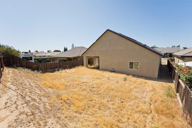 540 Shady Meadow Ct, Bakersfield, CA 93308 - back of house with a fenced backyard and stucco siding