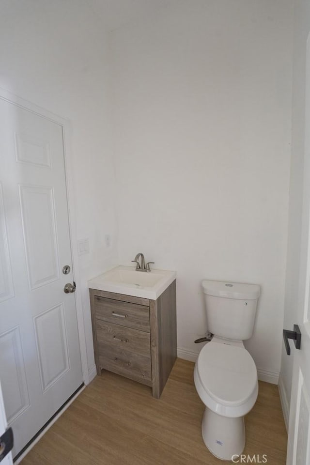 540 Shady Meadow Ct, Bakersfield, CA 93308 - half bath featuring vanity and wood finished floors