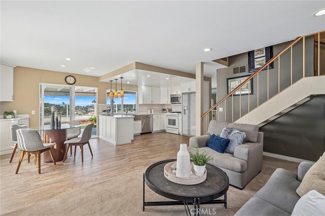 7012 E Viewpoint Ln, Anaheim Hills, CA 92807 - living area featuring recessed lighting, stairway, and light wood-type flooring