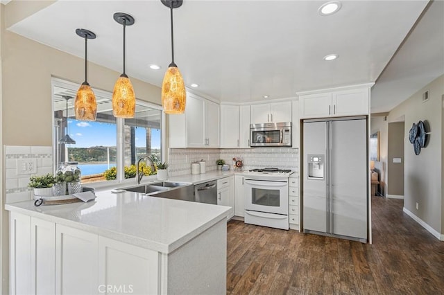 7012 E Viewpoint Ln, Anaheim Hills, CA 92807 - kitchen with appliances with stainless steel finishes, light countertops, white cabinets, tasteful backsplash, and recessed lighting