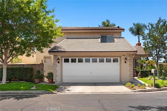 7012 E Viewpoint Ln, Anaheim Hills, CA 92807 - view of front of house with stucco siding, driveway, an attached garage, a tiled roof, and a chimney