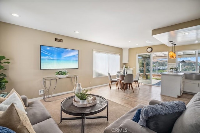 7012 E Viewpoint Ln, Anaheim Hills, CA 92807 - living room featuring healthy amount of natural light, recessed lighting, and light wood-style floors