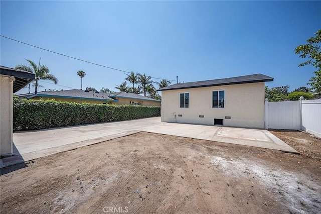 1021 W 5th St, Corona, CA 92882 - rear view of house with a patio, a fenced backyard, crawl space, and stucco siding