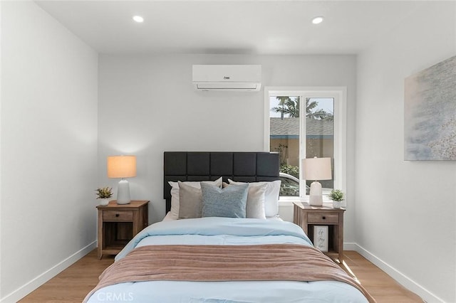 1021 W 5th St, Corona, CA 92882 - bedroom with a wall mounted air conditioner, light wood finished floors, and recessed lighting
