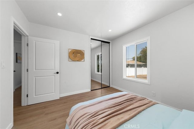 1021 W 5th St, Corona, CA 92882 - bedroom with wood finished floors, a closet, and recessed lighting