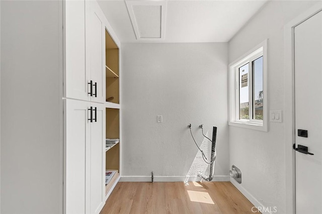1021 W 5th St, Corona, CA 92882 - laundry area with light wood finished floors