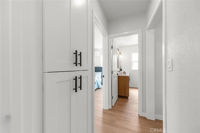 1021 W 5th St, Corona, CA 92882 - hallway with light wood finished floors and baseboards