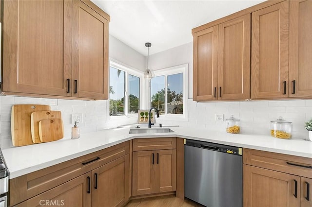 1021 W 5th St, Corona, CA 92882 - kitchen with stainless steel dishwasher, backsplash, light countertops, and brown cabinets