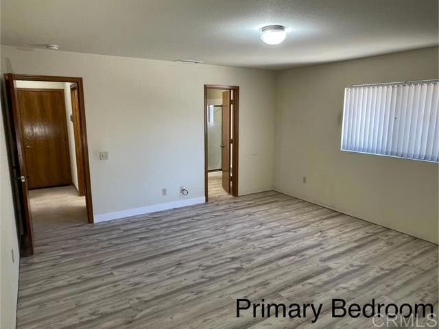 1003 Amherst Ave, Hemet, CA 92544 - unfurnished room with wood finished floors and a smoke detector