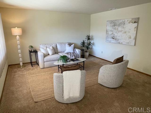 1003 Amherst Ave, Hemet, CA 92544 - carpeted living area with baseboards