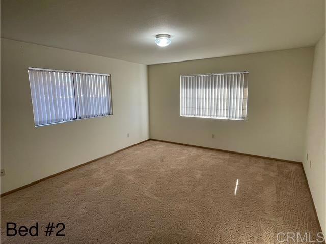 1003 Amherst Ave, Hemet, CA 92544 - spare room featuring carpet floors and baseboards
