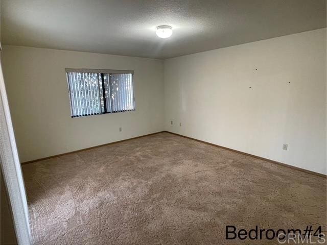 1003 Amherst Ave, Hemet, CA 92544 - empty room with carpet and baseboards