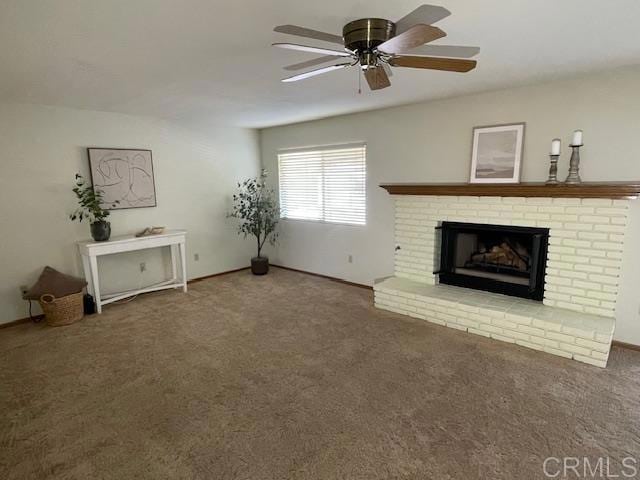 1003 Amherst Ave, Hemet, CA 92544 - unfurnished living room with carpet, a brick fireplace, and a ceiling fan