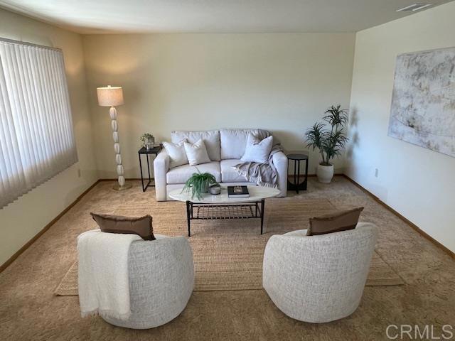 1003 Amherst Ave, Hemet, CA 92544 - carpeted living area featuring baseboards
