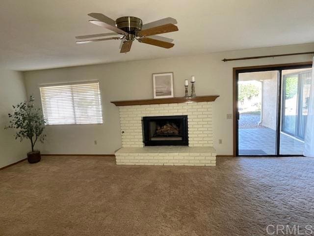 1003 Amherst Ave, Hemet, CA 92544 - unfurnished living room with healthy amount of natural light, carpet floors, and a fireplace