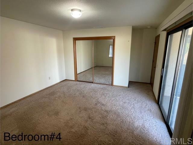 1003 Amherst Ave, Hemet, CA 92544 - unfurnished bedroom featuring light carpet and a closet