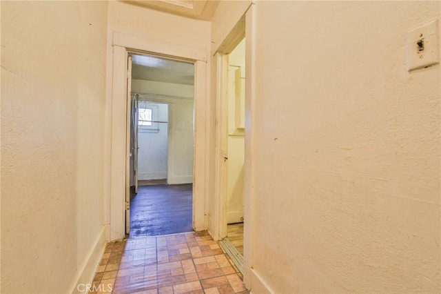1615 W 39th Pl, Los Angeles, CA 90062 - hall with brick patterned floors and a textured wall