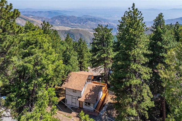 31303 Marcella Dr, Running Springs, CA 92382 - aerial view of property and surrounding area with a mountainous background and a heavily wooded area