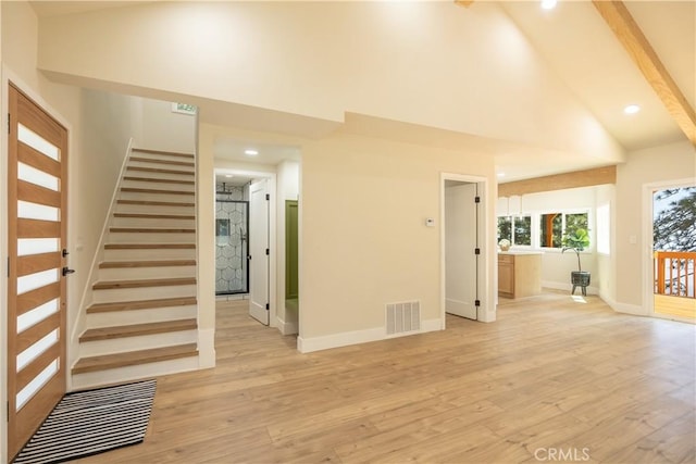 31303 Marcella Dr, Running Springs, CA 92382 - unfurnished living room featuring light wood-style flooring, high vaulted ceiling, recessed lighting, and stairs