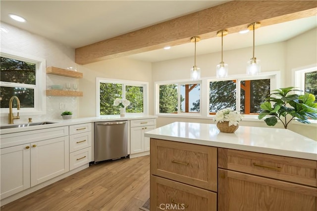 31303 Marcella Dr, Running Springs, CA 92382 - kitchen featuring dishwasher, light wood-type flooring, light countertops, hanging light fixtures, and beam ceiling