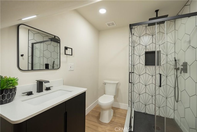 31303 Marcella Dr, Running Springs, CA 92382 - full bathroom featuring vanity, wood finished floors, a shower stall, recessed lighting, and lofted ceiling