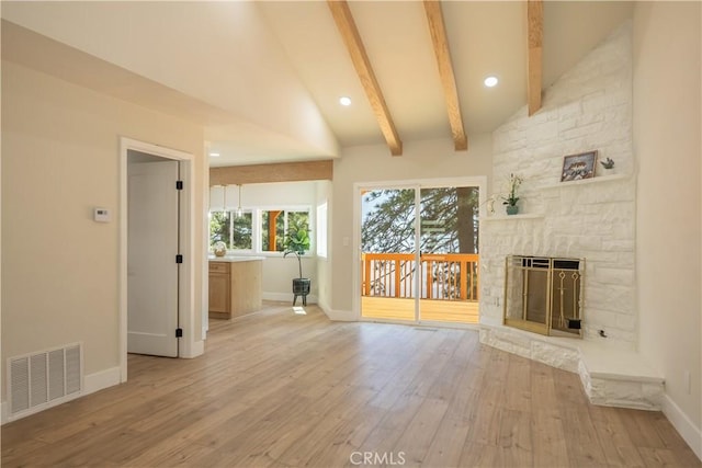 31303 Marcella Dr, Running Springs, CA 92382 - unfurnished living room with wood-type flooring, a stone fireplace, and recessed lighting