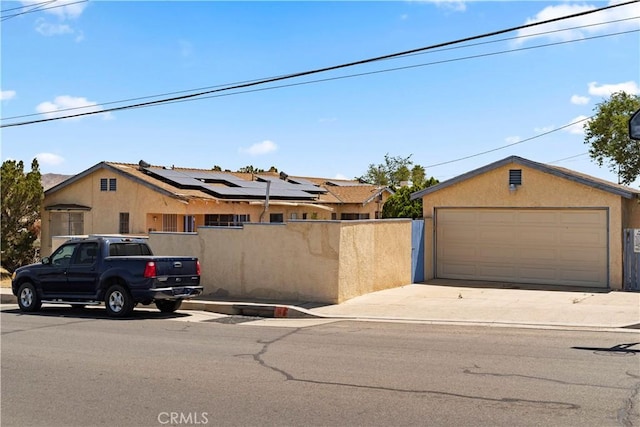 100 E Buena Vista St, Barstow, CA 92311 - view of front of property featuring stucco siding and a detached garage