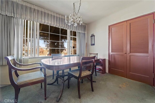 100 E Buena Vista St, Barstow, CA 92311 - carpeted dining area with a chandelier