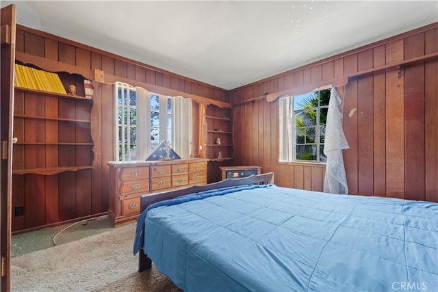 100 E Buena Vista St, Barstow, CA 92311 - carpeted bedroom featuring wooden walls