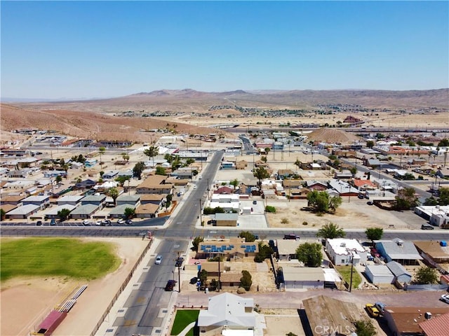 100 E Buena Vista St, Barstow, CA 92311 - aerial perspective of suburban area featuring a mountainous background