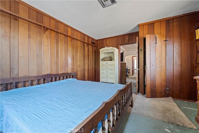 100 E Buena Vista St, Barstow, CA 92311 - bedroom with wooden walls and carpet floors