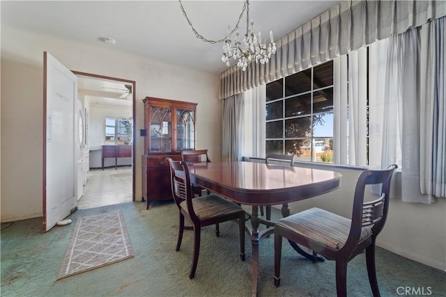 100 E Buena Vista St, Barstow, CA 92311 - dining room featuring carpet and a chandelier